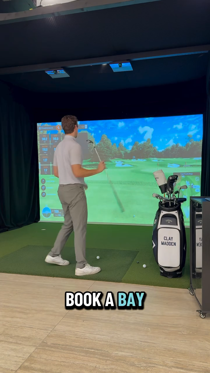 Member mid-swing with TrackMan data on screen