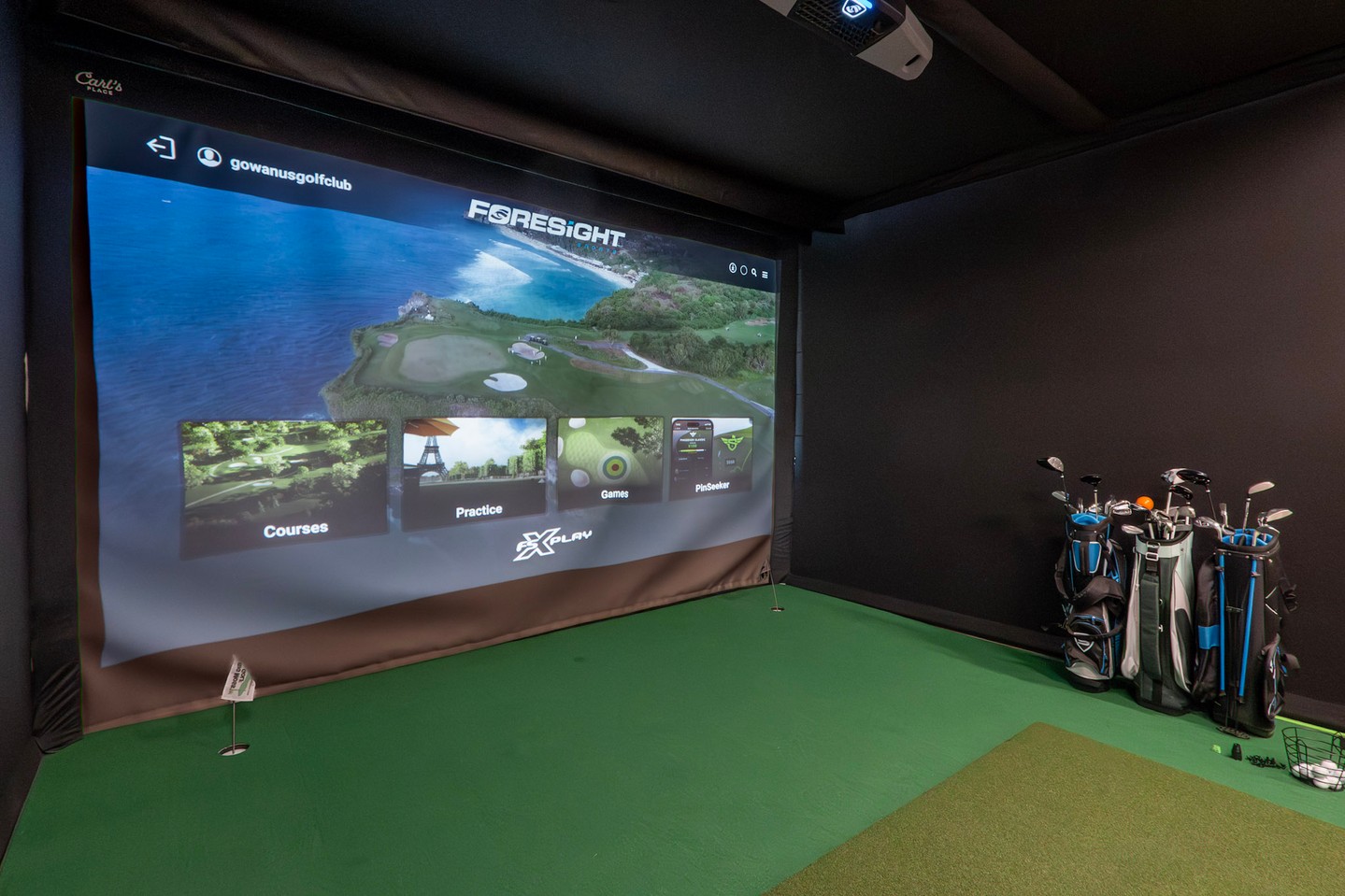 Golf simulator bay with Foresight screen