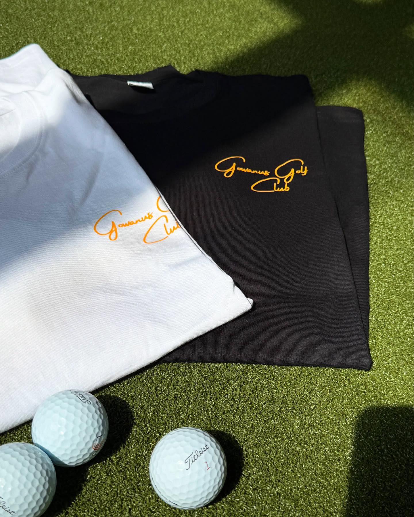 Gowanus Golf Club branded shirts with golf balls on turf